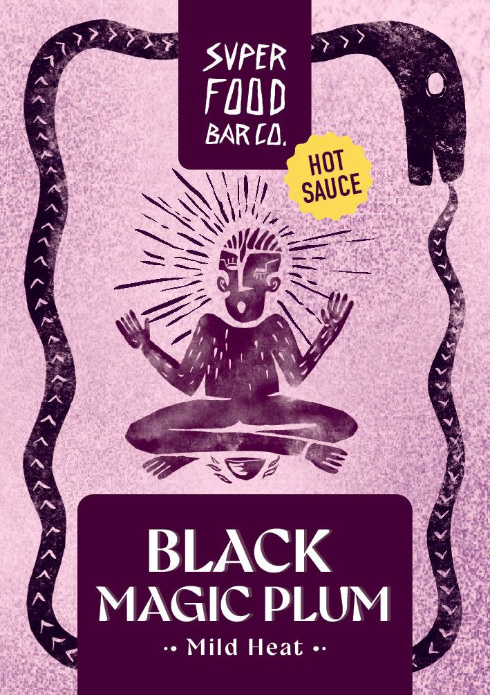 Close-up of Black Magic Plum hot sauce front label showing illustration and design details