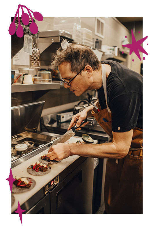 Chef Joseph Stone cooking in his kitchen