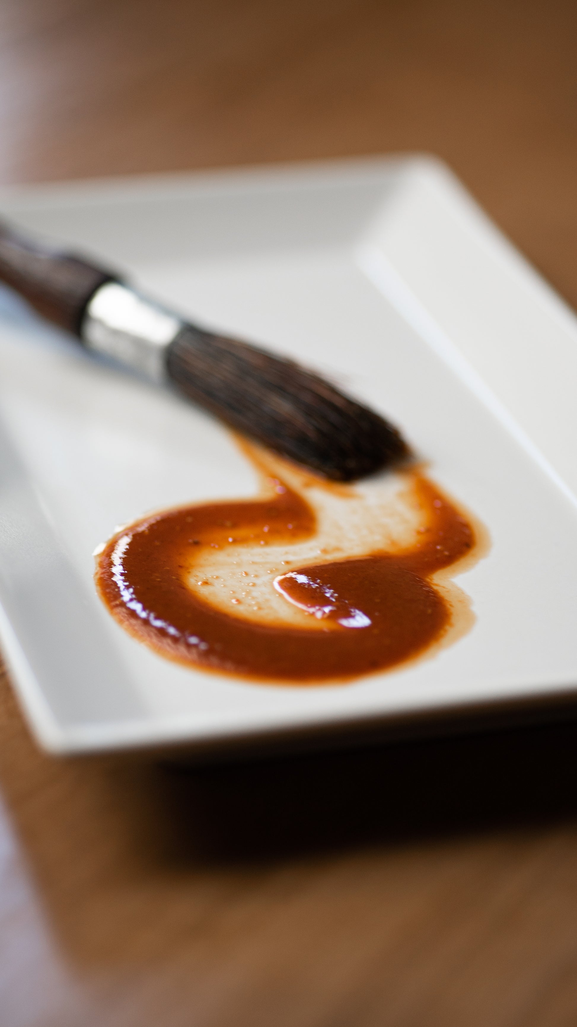 Red Hot Goji hot sauce spread on a plate to show color and texture